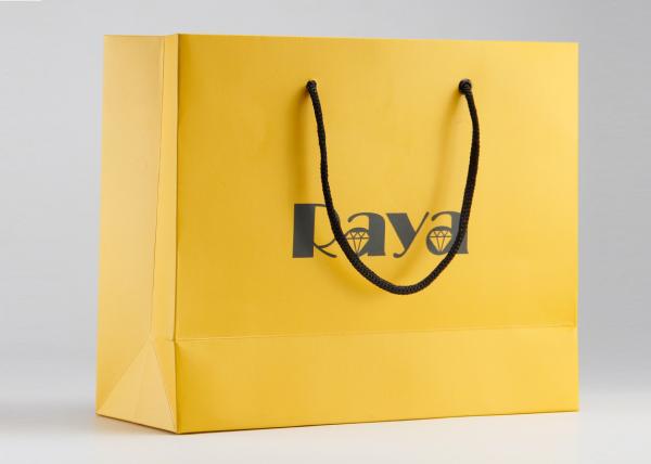 Yellow Matte Paper Shopping Bags Nylon Handle And Customized Logo Printed