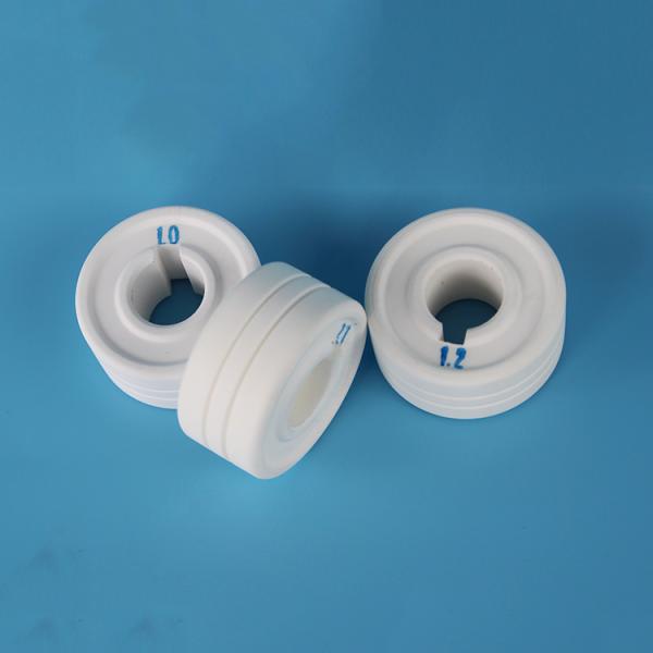 Corrosion resistant ceramics for alumina wire feeder