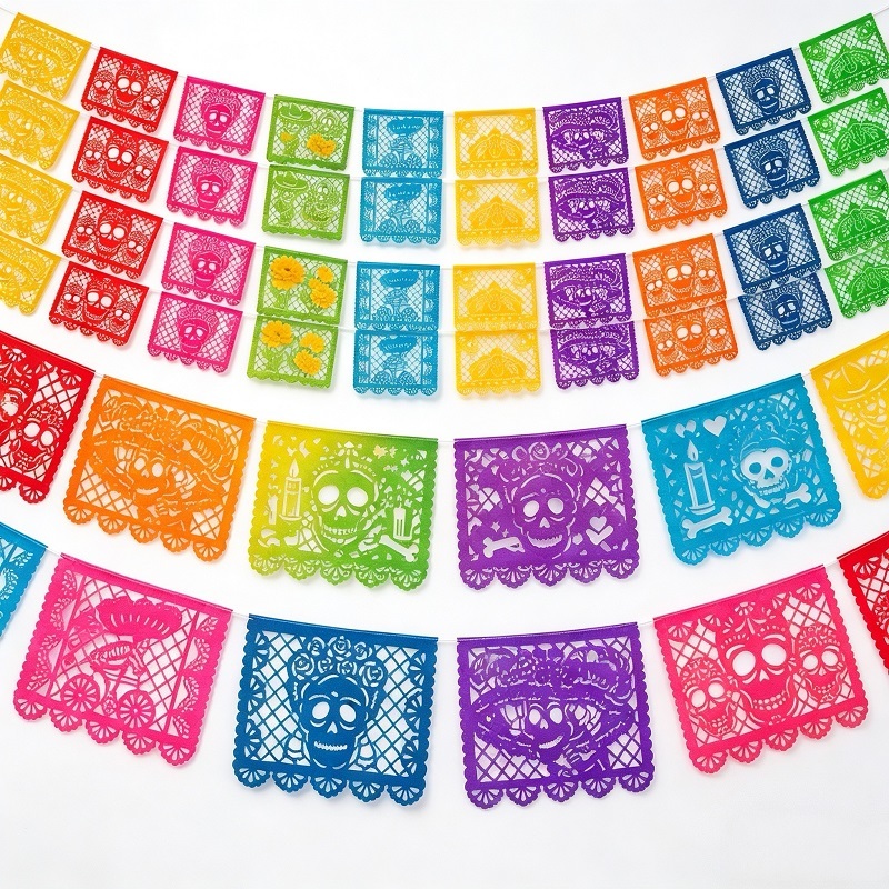 Artisanal papel picado banners for ofrenda with traditional laser cut motifs