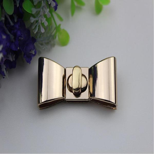 Hanging plating zinc alloy fashion gold metal bow-knot pattern small purse turn locks