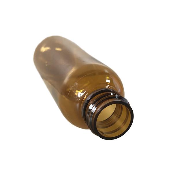 2 Oz Round Squeezable Clear Brown PET Bottle With Spray Pump 20/410