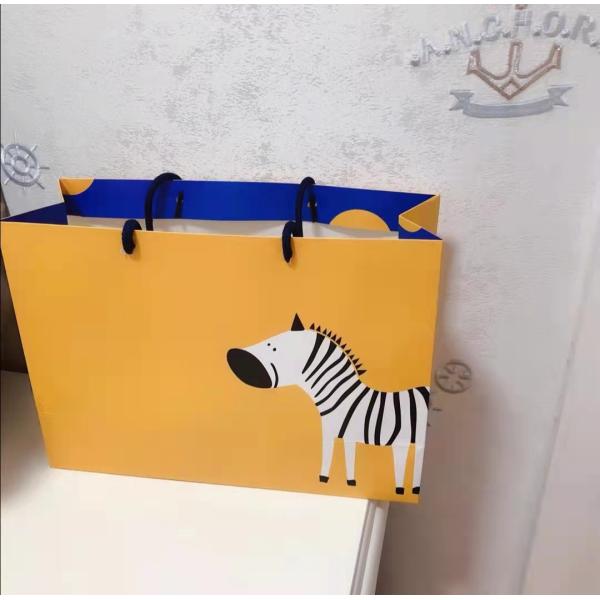 Бумажный мешок доски дуплекса печати зебры бумажных мешков одежды FSC ISO9001 желтый