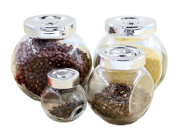 O cilindro liso claro dá forma ao armazenamento de vidro vazio do alimento dos frascos para doces/especiarias