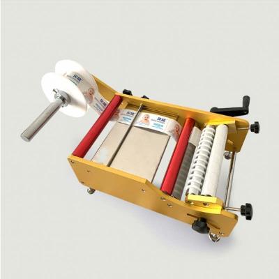 Máquina de rotulagem de embalagens de adesivos manuais para garrafas redondas