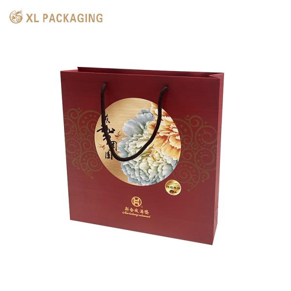 Venta al por mayor Bolsas de papel impresas con logotipo personalizado Bolsas de papel de regalo con mango