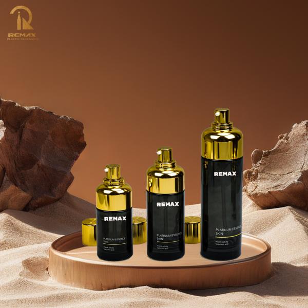 Bouteille noire cylindrique 50g 100g enduite d'or avec capuchon à fil d'emballage