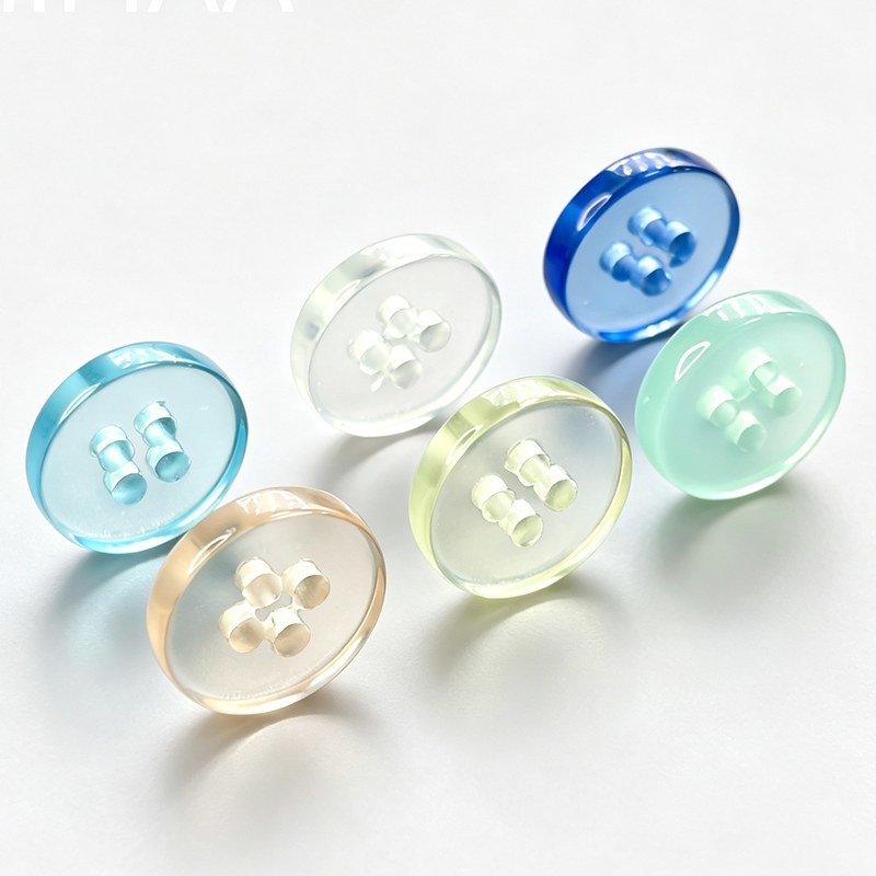 High-strength glass buttons with transparent texture and 10mm-40mm size range for fashion garments