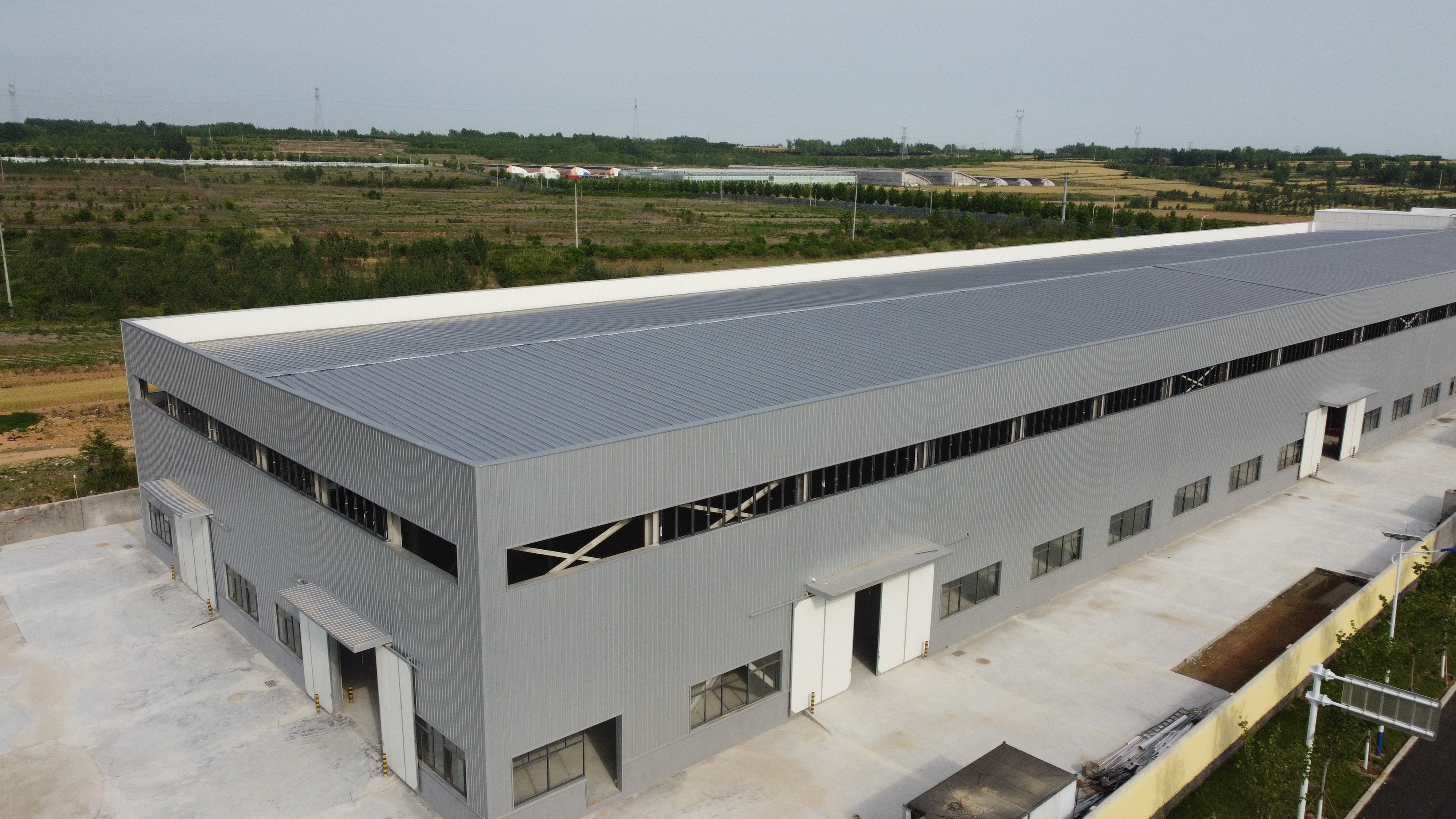 High Anti-rust Bolt Connection Prefab Steel Workshop Wind Snow Resistant Industrial Building Single Sheet Sandwich Panel Enclosure System