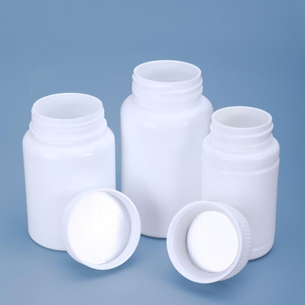 Frasco de pílulas de medicamento em HDPE com embalagem acrílica selada sob medida e vedação em folha de alumínio