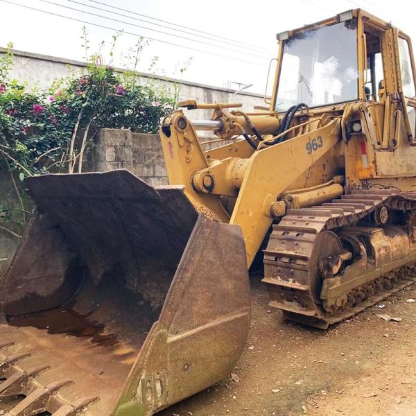 Использованная загрузчица Cat 963 с рельсовым погрузчиком