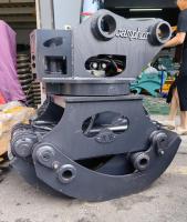 Traction hydraulique rotative de troncs de bois pour la démolition des déchets de bois