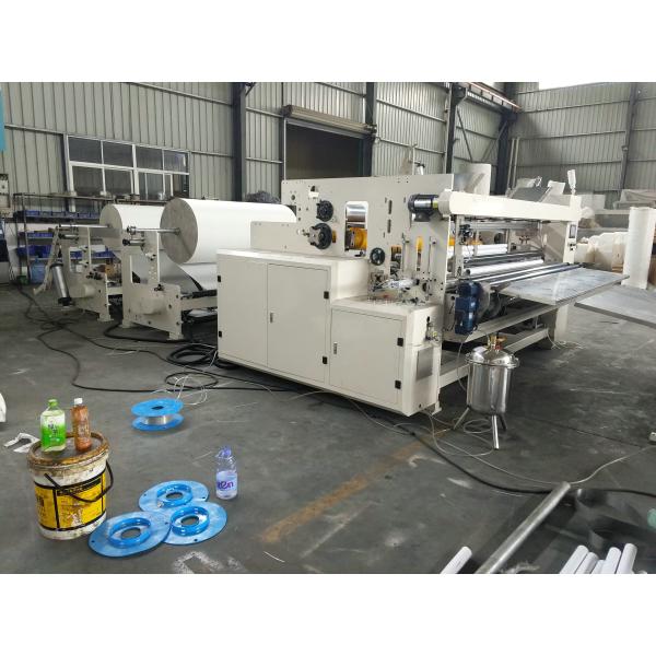 Machine à rembobiner les rouleaux de papier toilette et d'essuie-tout