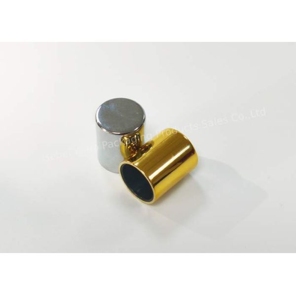 Tapa de botella de perfume cilíndrica de alumita, oro y plata, textura lujosa