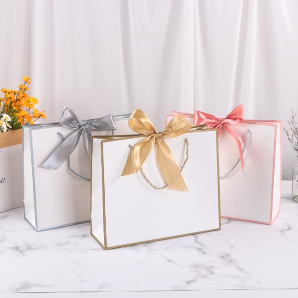 Sac shopping en papier avec nœud papillon pour cosmétiques, sac cadeau multicolore pour emballage de vêtements avec impression de logo