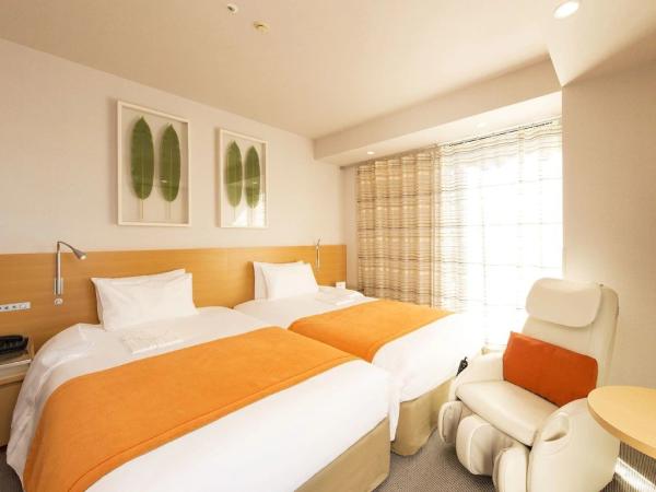 Tonga hotel interior design of custom furniture laminate wood headboard bed with massage chair and in wall cabinet desk