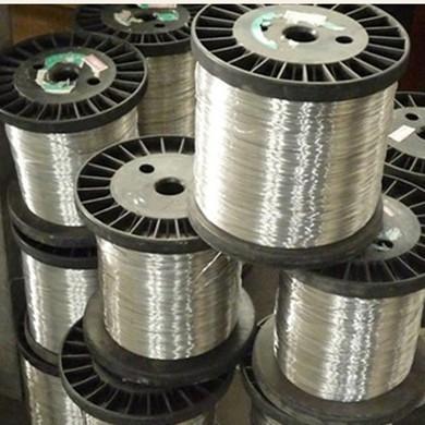 Temperature compensating magnetic alloys
