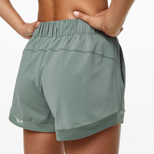 Лето женщин освобождает быстрые сухие атлетические спорт разминка замыкает накоротко с карманами