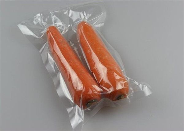 Пластиковый материал ПЭ нейлона и выбивая поверхность регулируя сумку уплотнителя вакуума вкладчика еды товарного сорта упаковывая свертывают