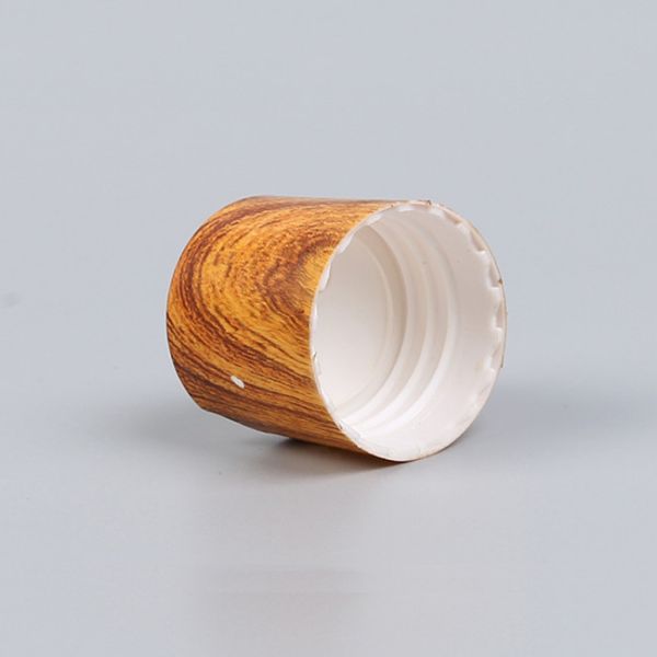 Пластмасса влияния крышек бутылки лосьона Tassel 28-410 деревянная разливает крышки по бутылкам диска верхние