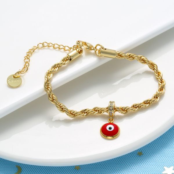 O óleo deixa cair o bracelete do ouro 18K