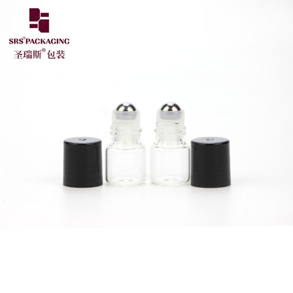 Wholesale cosmetic mini transparent color round essential oil 1ml glass roll on bottle