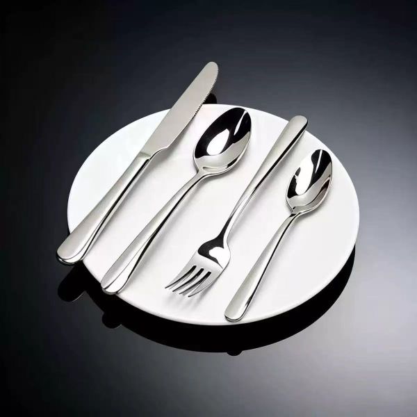 Hotel restaurant stainless steel steak knife, fork, spoon, and Western dining utensils.