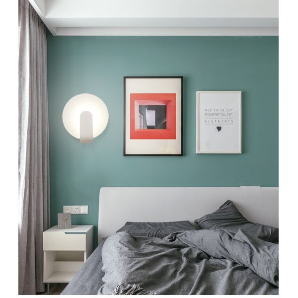 Modern simple and creative bedroom bedroom iron art wall lamp.