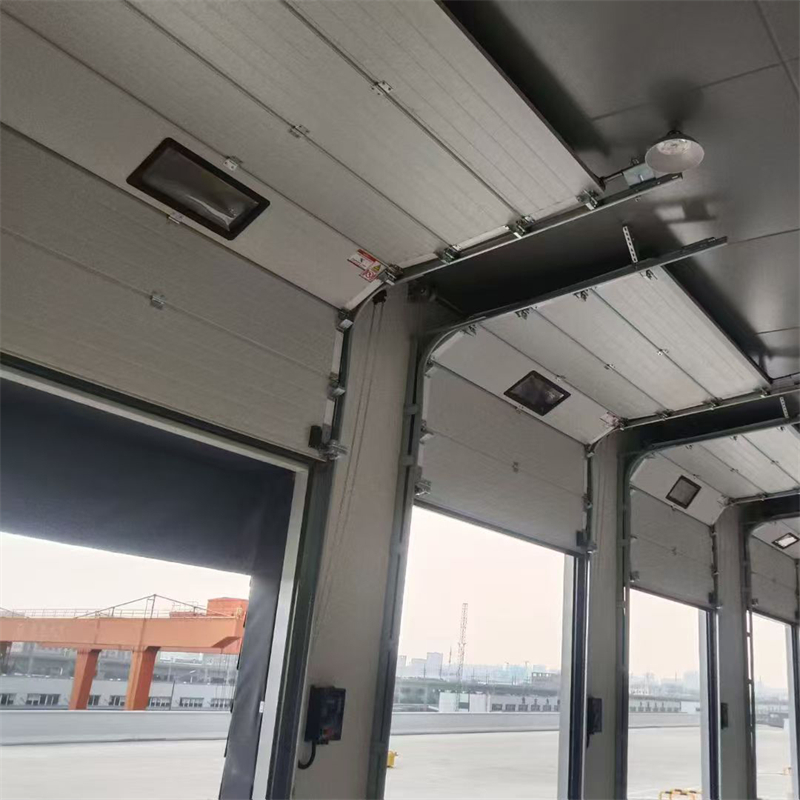 0.3-0.6mm Color-Coated Steel Industrial Sectional Overhead Door For Logistics Transit Warehouses