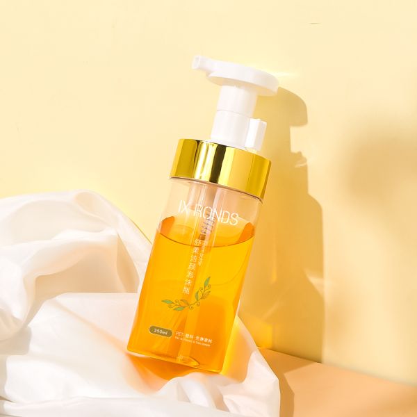 White transparent round foam pump bottle made of high-quality PET material with ergonomic pump head design and multiple capacity options for facial cleanser and body wash