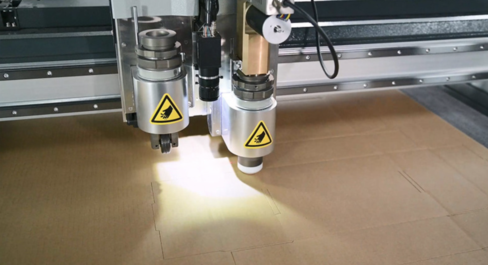 CNC corrugated box cutting machine with knife cutting and creasing tools. No die needed. High precision for carton & packaging boxes.