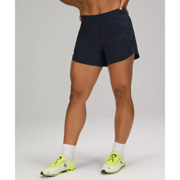 Шорты и разминка женщин идущие замыкают накоротко сторону с карманом молнии для спорт