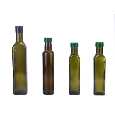 Garrafa de azeite de vidro de 750 Ml na máquina conservada em estoque da proteção da luz solar feita