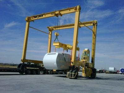 Wind Turbine Section Lifted By Two Travelifts With I Beams Featuring Center Swivels