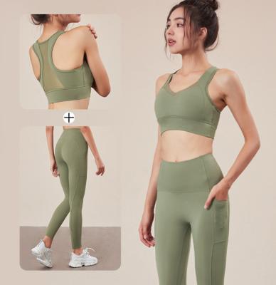 Calças sexy da ioga do Sportswear da aptidão e malha preta ajustada do sutiã dos esportes com bolsos