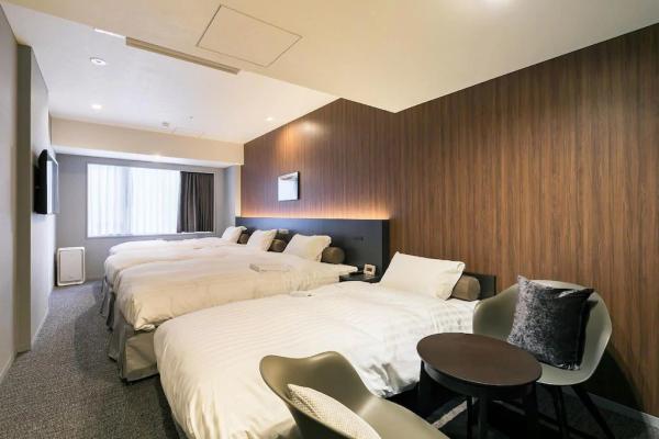 Auckland hotel inn resort Laminate wood headboard bed with in wall cabinet and TV panel stand