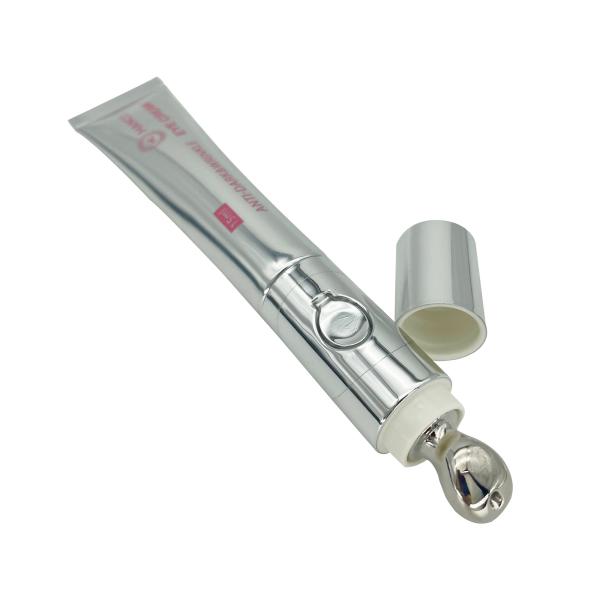 Customized Lotion Squeeze Tube Eye Cream Massage Packaging Cosmetic Plastic Soft Tube with Massage Applicator Zinc Alloy
