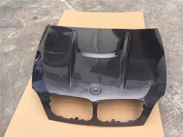 Transform Your BMW X6M E71 with HAMANN Carbon Fiber Front Cover and Spot Design