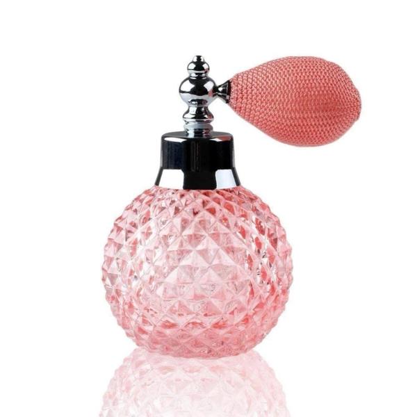 Despeje las botellas de perfume vacías de cristal talladas comprobadas con el atomizador del espray