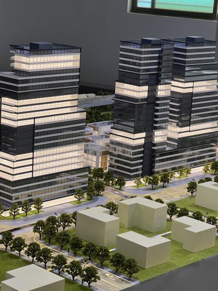 Architectural Model of Modern Urban Complex with Integrated Stadium, Business District and Landscaping