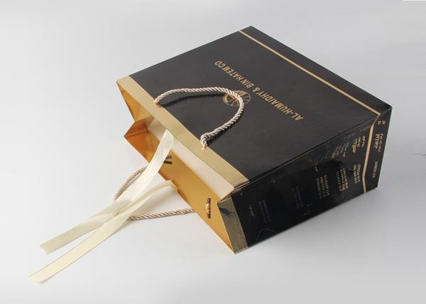 Luxury Glossy Black Gift Bags With Foil Hot Stamping And PP Rope Handle