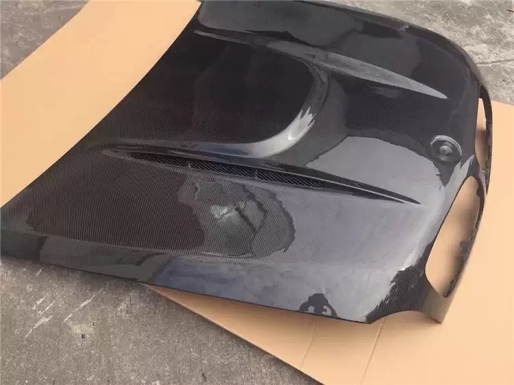 Transform Your BMW X6M E71 with HAMANN Carbon Fiber Front Cover and Spot Design
