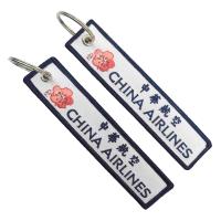Double côté clés brodées personnalisées Airlines Plum Blossom Insignia Bilingue