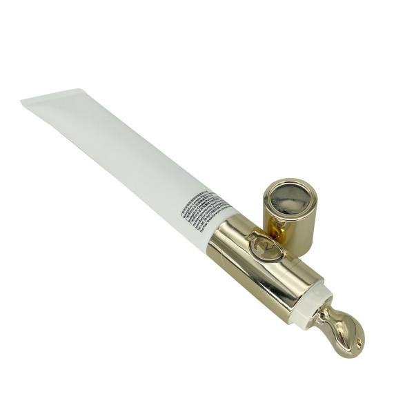 Customized Lotion Squeeze Tube Eye Cream Massage Packaging Cosmetic Plastic Soft Tube with Massage Applicator Zinc Alloy