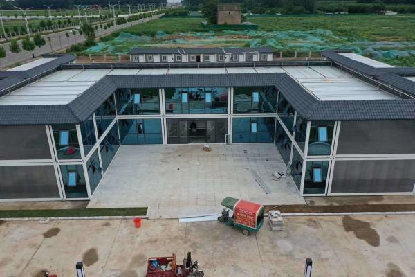 Prefabricado Armazém de aço Casa de painéis de sanduíche Container de embalagem plana de construção rápida