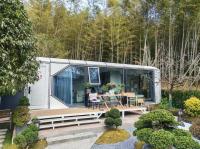 Maison capsule préfabriquée moderne de luxe avec balcon cadre en acier galvanisé 11,5*3,4*3,4m