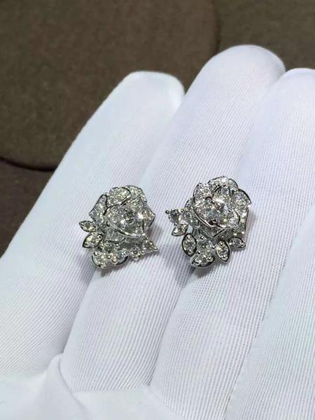 Piaget brand jewelry 18kt  Piaget Rose earrings in 18K white gold set with 72 brilliant-cut diamonds (approx. 0.45 ct).