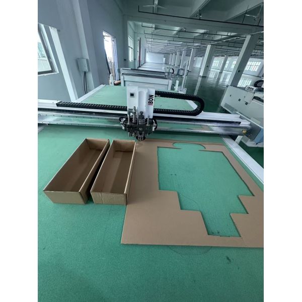 CNC corrugated box cutting machine with knife cutting and creasing tools. No die needed. High precision for carton & packaging boxes.