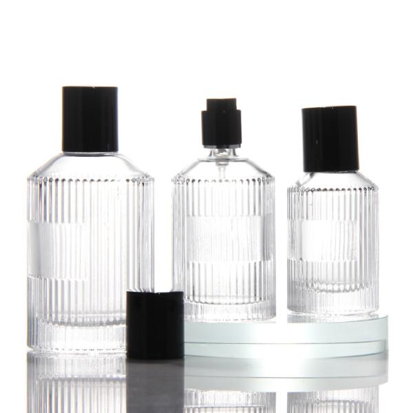 Bouteille de parfums transparente en cylindre de haute qualité OEM Bouteille de parfums en verre de 50 ml avec pompe à pulvérisation de boîte-cadeau