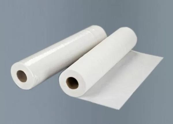 As folhas do SALÃO DE BELEZA 50 dos TERMAS da casa pelo rolo fazem massagens o rolo do papel da cama