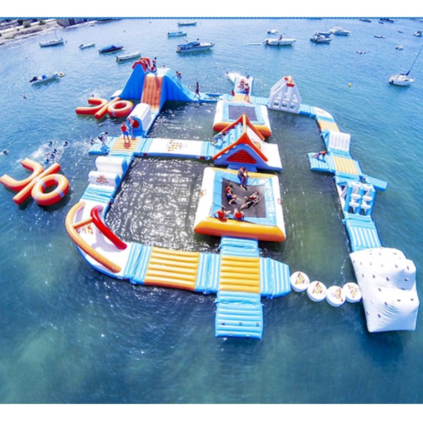 Modular Inflatable Water Park with Custom Floating Obstacle Course Slides Climbing Elements And Connected Play Platforms for Lake Resort Beach And Large Outdoor Aqua Recreation Projects